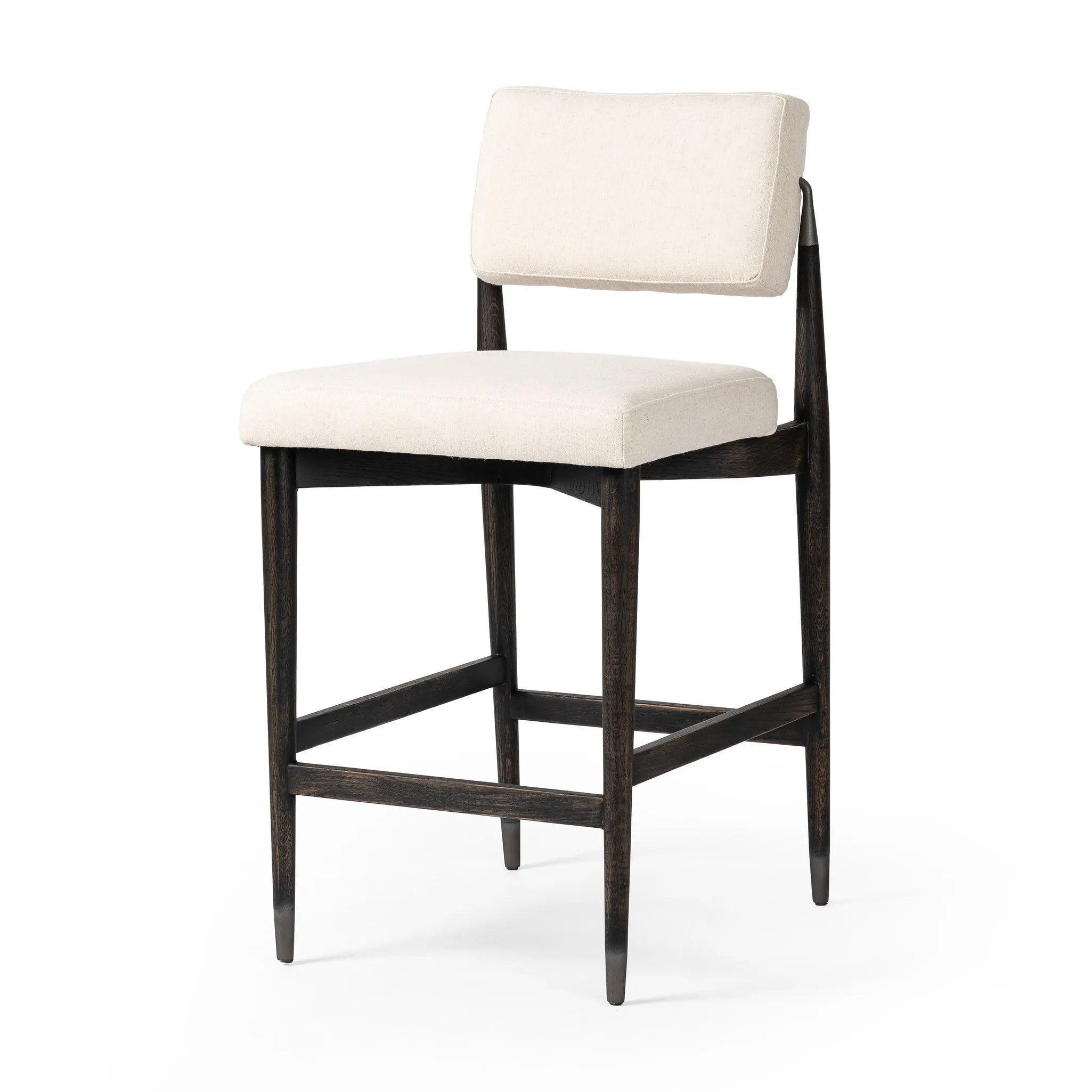 Eighties inspiration gone modern. With iron-dipped caps, tapered legs of solid oak frame this bar stool's seat and back, upholstered in light performance fabric. Slim wood stretchers add an airy vibe to this counter stool. Amethyst Home provides interior design, new home construction design consulting, vintage area rugs, and lighting in the Seattle metro area.