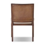Featuring Antonia Savile Flax Cane Armless Dining Chair by Four Hands at Amethyst Home. Mixed materials refresh a retro style. Cane frames performance fabric seating with slight distressing, bringing more character to the seat. Performance fabrics are specially created to withstand spills, stains, high traffic and wear, ensuring long-term comfort and unmatched. Amethyst Home provides interior design, new home construction design consulting, vintage area rugs, and lighting in the Dallas metro area.