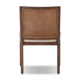 Featuring Antonia Savile Flax Cane Armless Dining Chair by Four Hands at Amethyst Home. Mixed materials refresh a retro style. Cane frames performance fabric seating with slight distressing, bringing more character to the seat. Performance fabrics are specially created to withstand spills, stains, high traffic and wear, ensuring long-term comfort and unmatched. Amethyst Home provides interior design, new home construction design consulting, vintage area rugs, and lighting in the Dallas metro area.