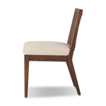 Featuring Antonia Savile Flax Cane Armless Dining Chair by Four Hands at Amethyst Home. Mixed materials refresh a retro style. Cane frames performance fabric seating with slight distressing, bringing more character to the seat. Performance fabrics are specially created to withstand spills, stains, high traffic and wear, ensuring long-term comfort and unmatche. Amethyst Home provides interior design, new home construction design consulting, vintage area rugs, and lighting in the Houston metro area.