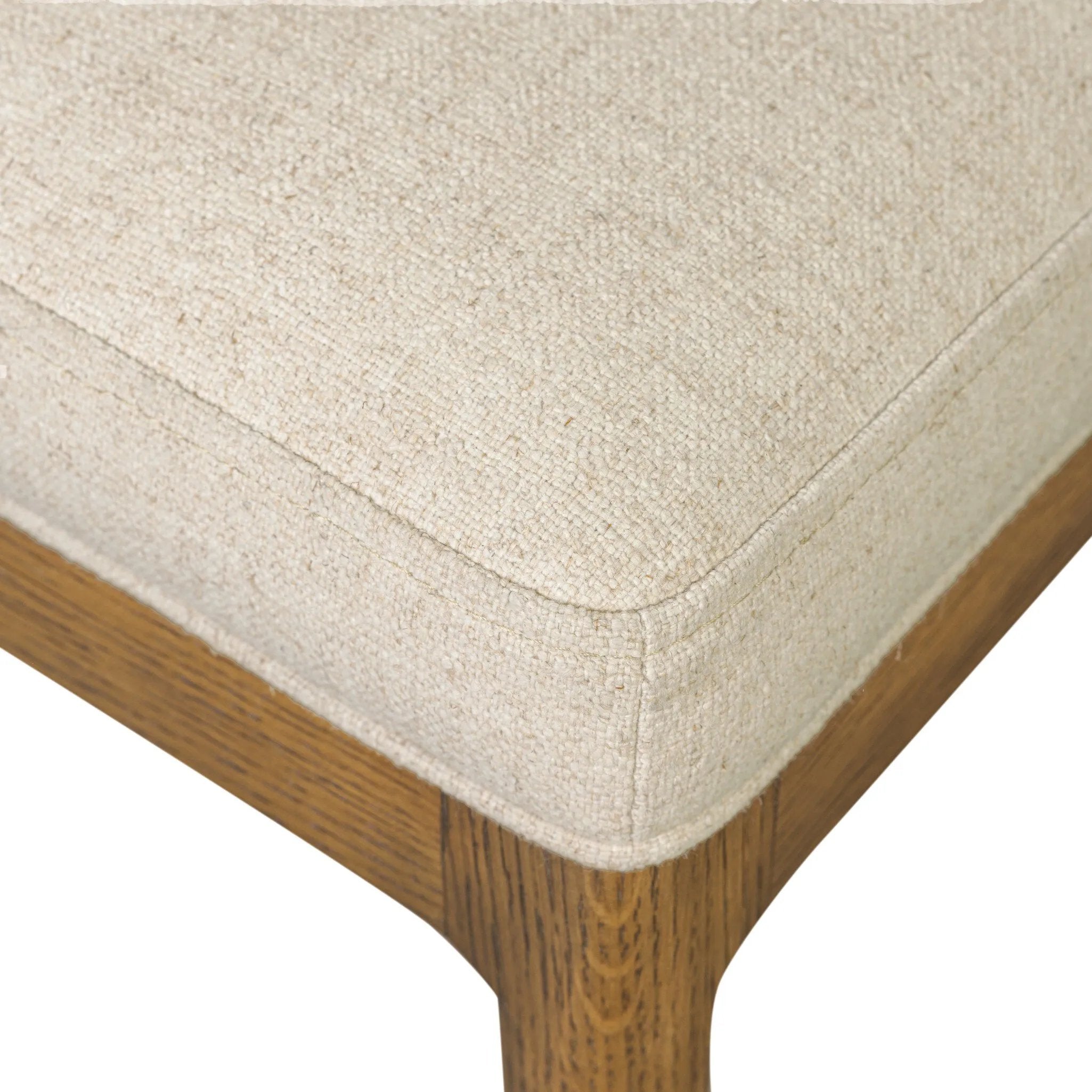 Midcentury meets organic modernism in this mixed-material dining chair. A top-grain leather seat back pairs with a cushioned seat upholstered in performance fabric, with stitch detailing along the seat back. All framed by solid oak finished in a warm amber. Amethyst Home provides interior design, new home construction design consulting, vintage area rugs, and lighting in the Kansas City metro area.