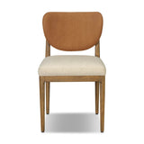 Midcentury meets organic modernism in this mixed-material dining chair. A top-grain leather seat back pairs with a cushioned seat upholstered in performance fabric, with stitch detailing along the seat back. All framed by solid oak finished in a warm amber. Amethyst Home provides interior design, new home construction design consulting, vintage area rugs, and lighting in the Portland metro area.