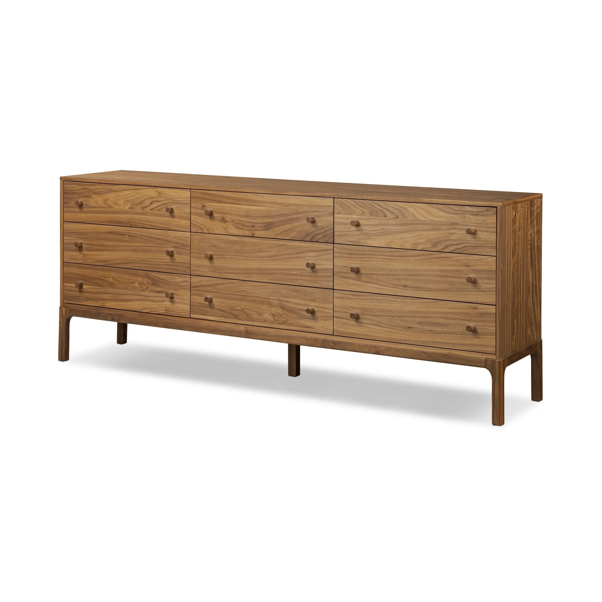 Inspired by campaign-style furniture of the 1800s — packable pieces first designed for traveling military use — a simply shaped dresser of natural walnut features a subtly inset top and rounded legs, finished with wooden hardware. This item has been modified to comply with the STURDY Act. Amethyst Home provides interior design, new home construction design consulting, vintage area rugs, and lighting in the Newport Beach metro area.