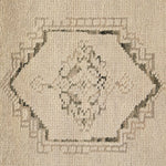 Patterned with a simplistic three-emblem motif framed by a narrow border, this hand-knotted wool rug adds just a touch of neutral design. The durable runner is crafted to wear beautifully over time. Due to the handcrafted nature of this rug, slight variations in sizing may occur Amethyst Home provides interior design, new home construction design consulting, vintage area rugs, and lighting in the Boston metro area.