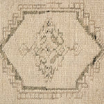 Patterned with a simplistic three-emblem motif framed by a narrow border, this hand-knotted wool rug adds just a touch of neutral design. The durable runner is crafted to wear beautifully over time. Due to the handcrafted nature of this rug, slight variations in sizing may occur Amethyst Home provides interior design, new home construction design consulting, vintage area rugs, and lighting in the Des Moines metro area.