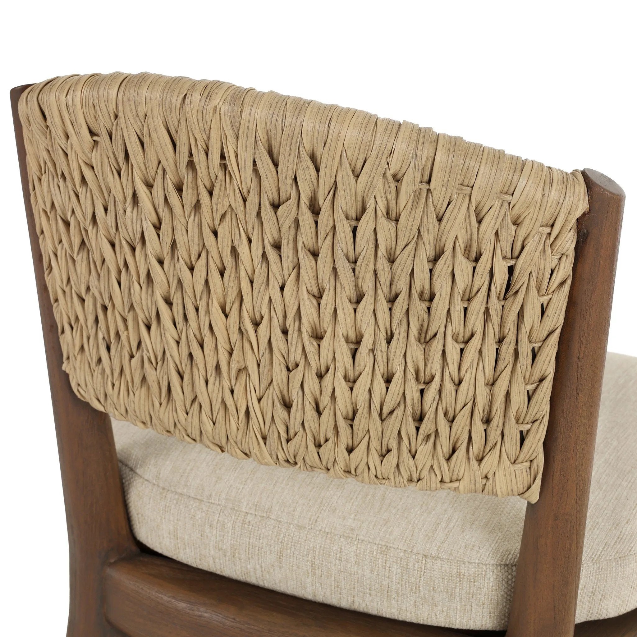 A fresh take on the traditional woven style, this outdoor dining chair features a faux banana leaf material wrapped in a bold, chunky texture around FSC®-certified teak framing. Cover or store indoors during inclement weather and when not in use. Amethyst Home provides interior design, new home construction design consulting, vintage area rugs, and lighting in the Park City metro area.