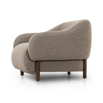 Featuring Audrey Weslie Feather Chair by Four Hands at Amethyst Home. This elevated arm chair features a clean top piece that partially overlaps its bottom counterpart and seamlessly blends the back cushion into the armrests in one fluid form. The seat's legs appear to extend from the seat and back, adding architectural interest. Upholstered in a recycled Turk. Amethyst Home provides interior design, new home construction design consulting, vintage area rugs, and lighting in the Boston metro area.