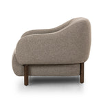 Featuring Audrey Weslie Feather Chair by Four Hands at Amethyst Home. This elevated arm chair features a clean top piece that partially overlaps its bottom counterpart and seamlessly blends the back cushion into the armrests in one fluid form. The seat's legs appear to extend from the seat and back, adding architectural interest. Upholstered in a recycled . Amethyst Home provides interior design, new home construction design consulting, vintage area rugs, and lighting in the Washington metro area.