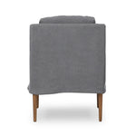 Heritage-inspired comfort. Sloping track arms are a study in playful forms, while the frame's fluid shape creates a simple, polished look. Tapered legs extend beyond a short skirt for a more relaxed style. Covered in 100% linen. A design collaboration by Amber Lewis and Four Hands. Amethyst Home provides interior design, new home construction design consulting, vintage area rugs, and lighting in the Austin metro area.