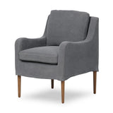 Heritage-inspired comfort. Sloping track arms are a study in playful forms, while the frame's fluid shape creates a simple, polished look. Tapered legs extend beyond a short skirt for a more relaxed style. Covered in 100% linen. A design collaboration by Amber Lewis and Four Hands. Amethyst Home provides interior design, new home construction design consulting, vintage area rugs, and lighting in the Calabasas metro area.