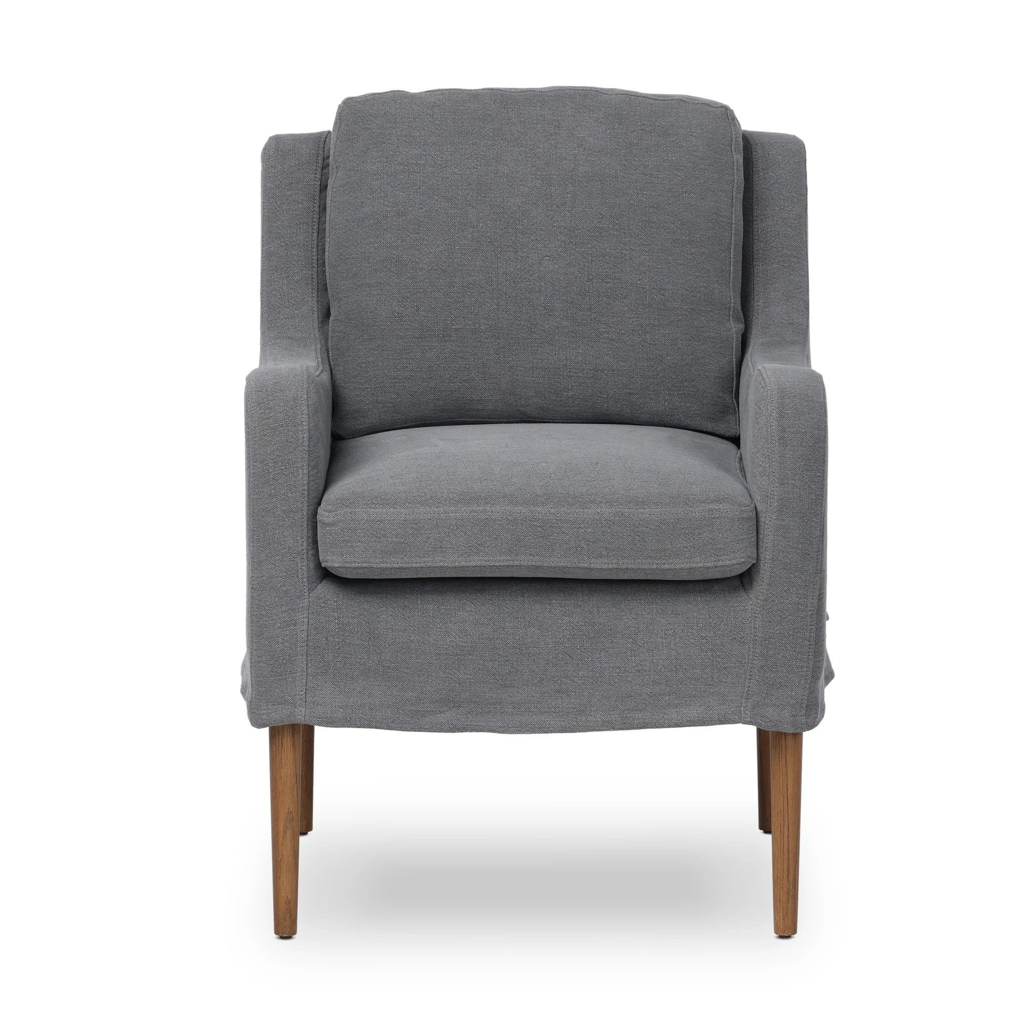 Heritage-inspired comfort. Sloping track arms are a study in playful forms, while the frame's fluid shape creates a simple, polished look. Tapered legs extend beyond a short skirt for a more relaxed style. Covered in 100% linen. A design collaboration by Amber Lewis and Four Hands. Amethyst Home provides interior design, new home construction design consulting, vintage area rugs, and lighting in the Dallas metro area.