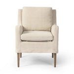 Heritage-inspired comfort. Sloping track arms are a study in playful forms, while the frame's fluid shape creates a simple, polished look. Tapered legs extend beyond a short skirt for a more relaxed style. Covered in 100% linen. A design collaboration by Amber Lewis and Four Hands. Amethyst Home provides interior design, new home construction design consulting, vintage area rugs, and lighting in the Des Moines metro area.