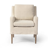 Heritage-inspired comfort. Sloping track arms are a study in playful forms, while the frame's fluid shape creates a simple, polished look. Tapered legs extend beyond a short skirt for a more relaxed style. Covered in 100% linen. A design collaboration by Amber Lewis and Four Hands. Amethyst Home provides interior design, new home construction design consulting, vintage area rugs, and lighting in the Des Moines metro area.