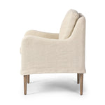 Heritage-inspired comfort. Sloping track arms are a study in playful forms, while the frame's fluid shape creates a simple, polished look. Tapered legs extend beyond a short skirt for a more relaxed style. Covered in 100% linen. A design collaboration by Amber Lewis and Four Hands. Amethyst Home provides interior design, new home construction design consulting, vintage area rugs, and lighting in the Nashville metro area.