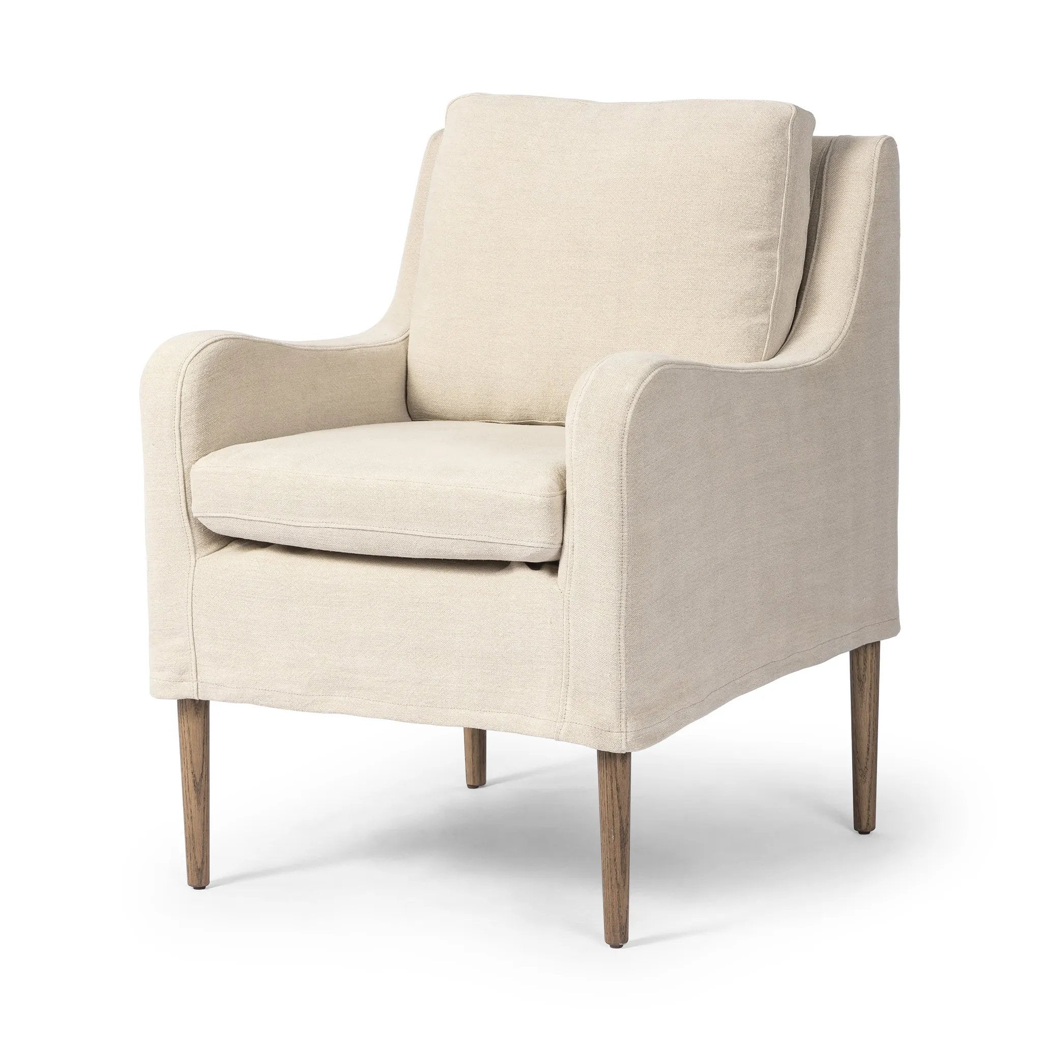 Heritage-inspired comfort. Sloping track arms are a study in playful forms, while the frame's fluid shape creates a simple, polished look. Tapered legs extend beyond a short skirt for a more relaxed style. Covered in 100% linen. A design collaboration by Amber Lewis and Four Hands. Amethyst Home provides interior design, new home construction design consulting, vintage area rugs, and lighting in the Park City metro area.