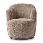 Intriguing while inviting, drum-style seating is upholstered in a soft, taupe shearling. A 360-degree swivel base of natural parawood places a fresh spin on a feminine form Amethyst Home provides interior design, new home construction design consulting, vintage area rugs, and lighting in the Boston metro area.