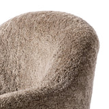 Intriguing while inviting, drum-style seating is upholstered in a soft, taupe shearling. A 360-degree swivel base of natural parawood places a fresh spin on a feminine form Amethyst Home provides interior design, new home construction design consulting, vintage area rugs, and lighting in the Charlotte metro area.