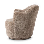 Intriguing while inviting, drum-style seating is upholstered in a soft, taupe shearling. A 360-degree swivel base of natural parawood places a fresh spin on a feminine form Amethyst Home provides interior design, new home construction design consulting, vintage area rugs, and lighting in the Monterey metro area.