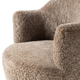 Intriguing while inviting, drum-style seating is upholstered in a soft, taupe shearling. A 360-degree swivel base of natural parawood places a fresh spin on a feminine form Amethyst Home provides interior design, new home construction design consulting, vintage area rugs, and lighting in the Nashville metro area.