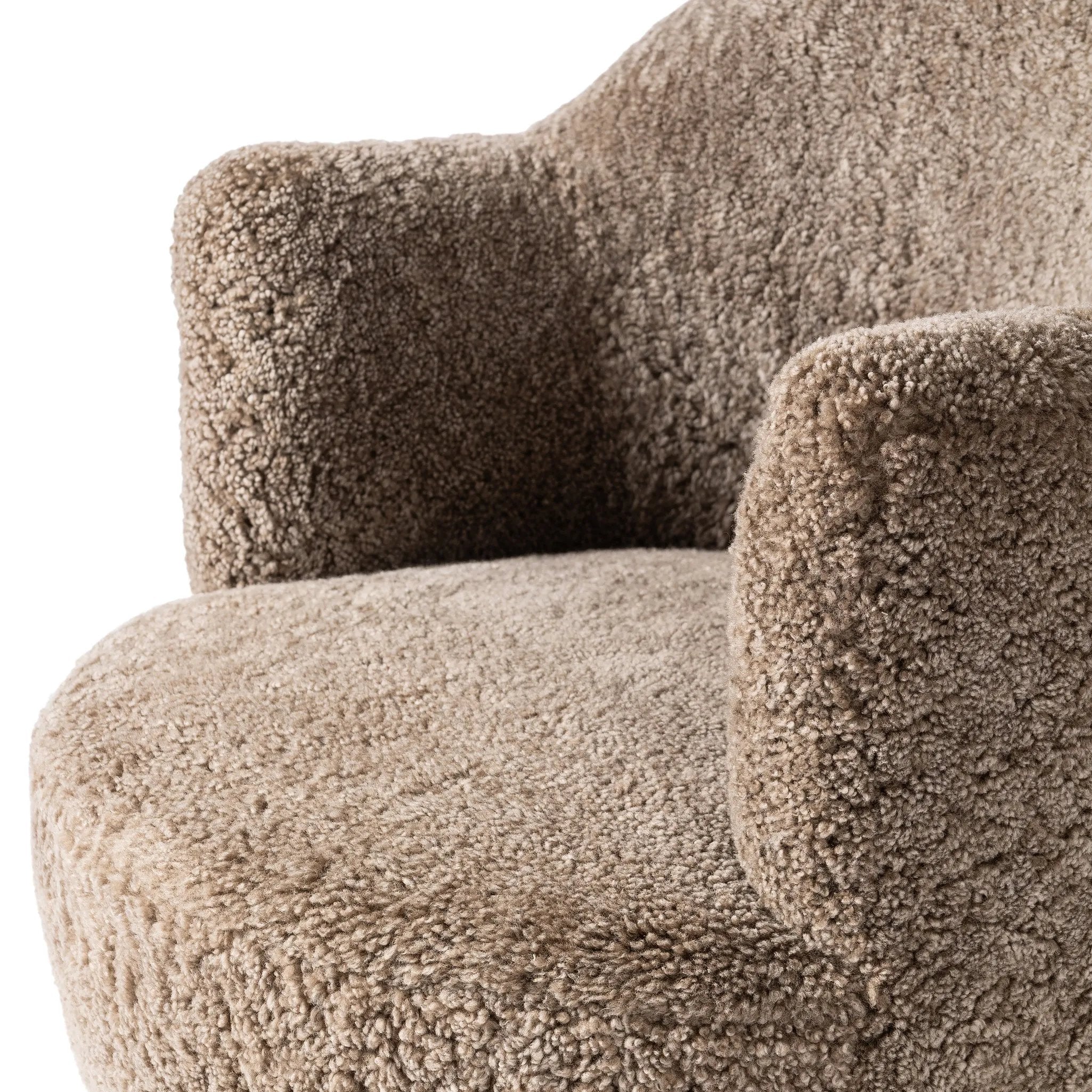 Intriguing while inviting, drum-style seating is upholstered in a soft, taupe shearling. A 360-degree swivel base of natural parawood places a fresh spin on a feminine form Amethyst Home provides interior design, new home construction design consulting, vintage area rugs, and lighting in the Nashville metro area.