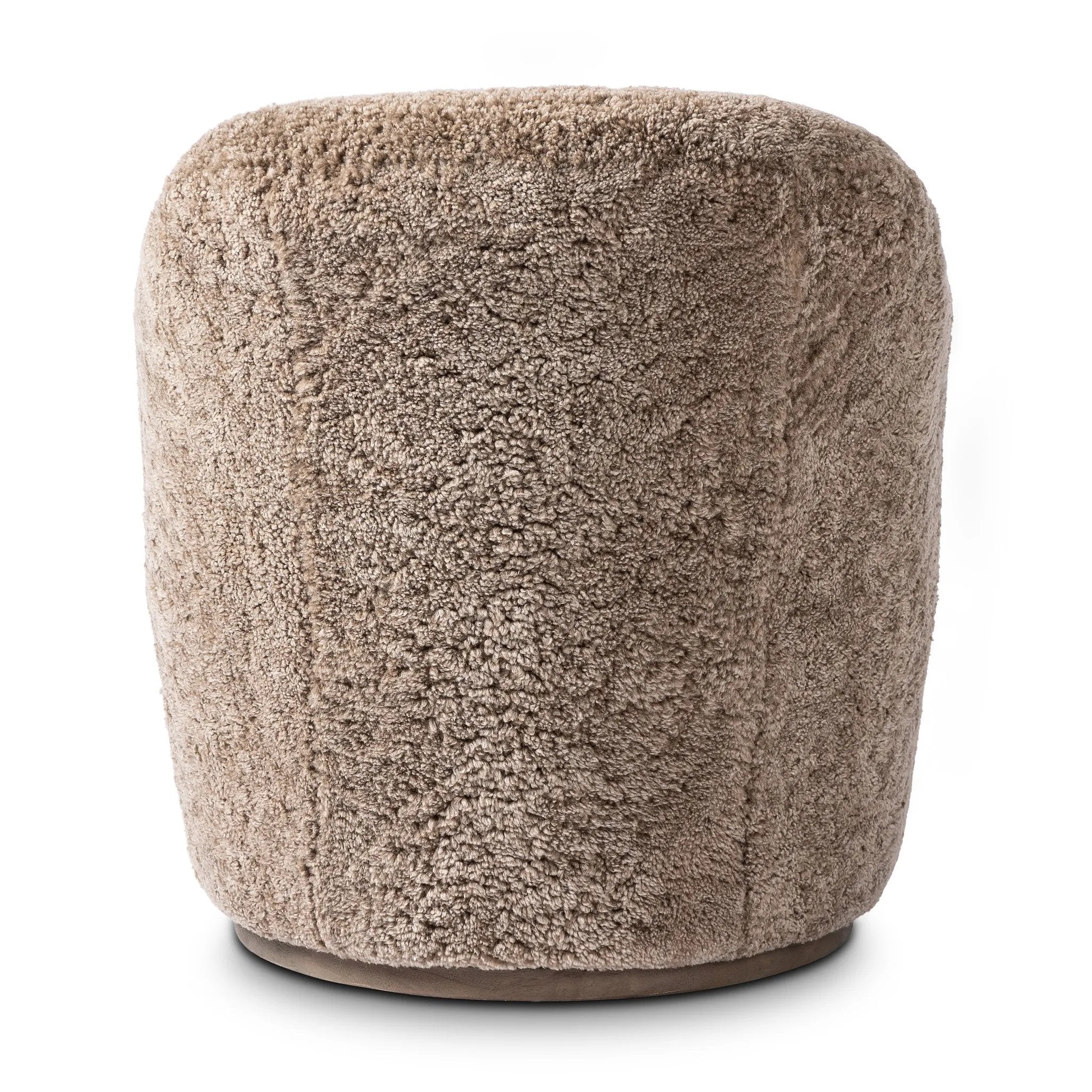 Intriguing while inviting, drum-style seating is upholstered in a soft, taupe shearling. A 360-degree swivel base of natural parawood places a fresh spin on a feminine form Amethyst Home provides interior design, new home construction design consulting, vintage area rugs, and lighting in the Newport Beach metro area.