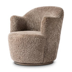 Intriguing while inviting, drum-style seating is upholstered in a soft, taupe shearling. A 360-degree swivel base of natural parawood places a fresh spin on a feminine form Amethyst Home provides interior design, new home construction design consulting, vintage area rugs, and lighting in the Omaha metro area.