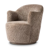 Intriguing while inviting, drum-style seating is upholstered in a soft, taupe shearling. A 360-degree swivel base of natural parawood places a fresh spin on a feminine form Amethyst Home provides interior design, new home construction design consulting, vintage area rugs, and lighting in the Omaha metro area.