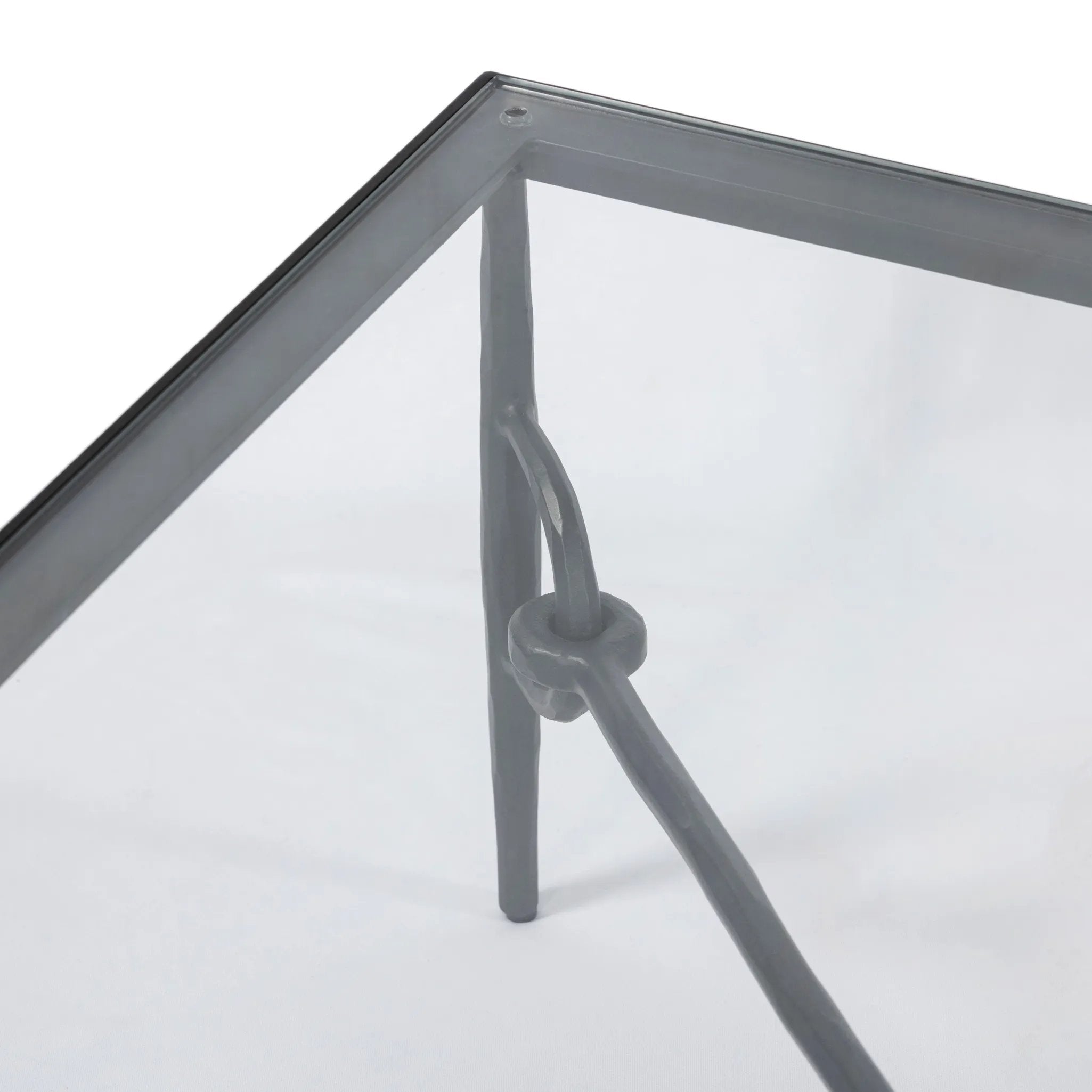 Featuring Babylon Tempered Glass Coffee Table by Four Hands at Amethyst Home. A slim, spare frame of hammered gunmetal pairs with tempered glass, for a clean and timeless coffee table look. Stretchers attach to metal loops for an elevated design detail.Overall Dimensions: 48.00"w x 48.00"d x 16.00"hWeight : 144.67 lbsMaterials: Tempered Glass, Iron. Amethyst Home provides interior design, new home construction design consulting, vintage area rugs, and lighting in the Winter Garden metro area.