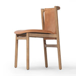 Featuring Baden Haven Tobacco Dining Chair by Four Hands at Amethyst Home. Midcentury-inspired with its minimalist wooden frame, this armless dining chair features a low back and float-like seat upholstered in tobacco top-grain leather exclusive to Four Hands. Leather wrap detailing for texture.Overall Dimensions: 19.75"w x 23.25"d x 32.25"hWeight : 14.99 lbsMa. Amethyst Home provides interior design, new home construction design consulting, vintage area rugs, and lighting in the Tampa metro area.