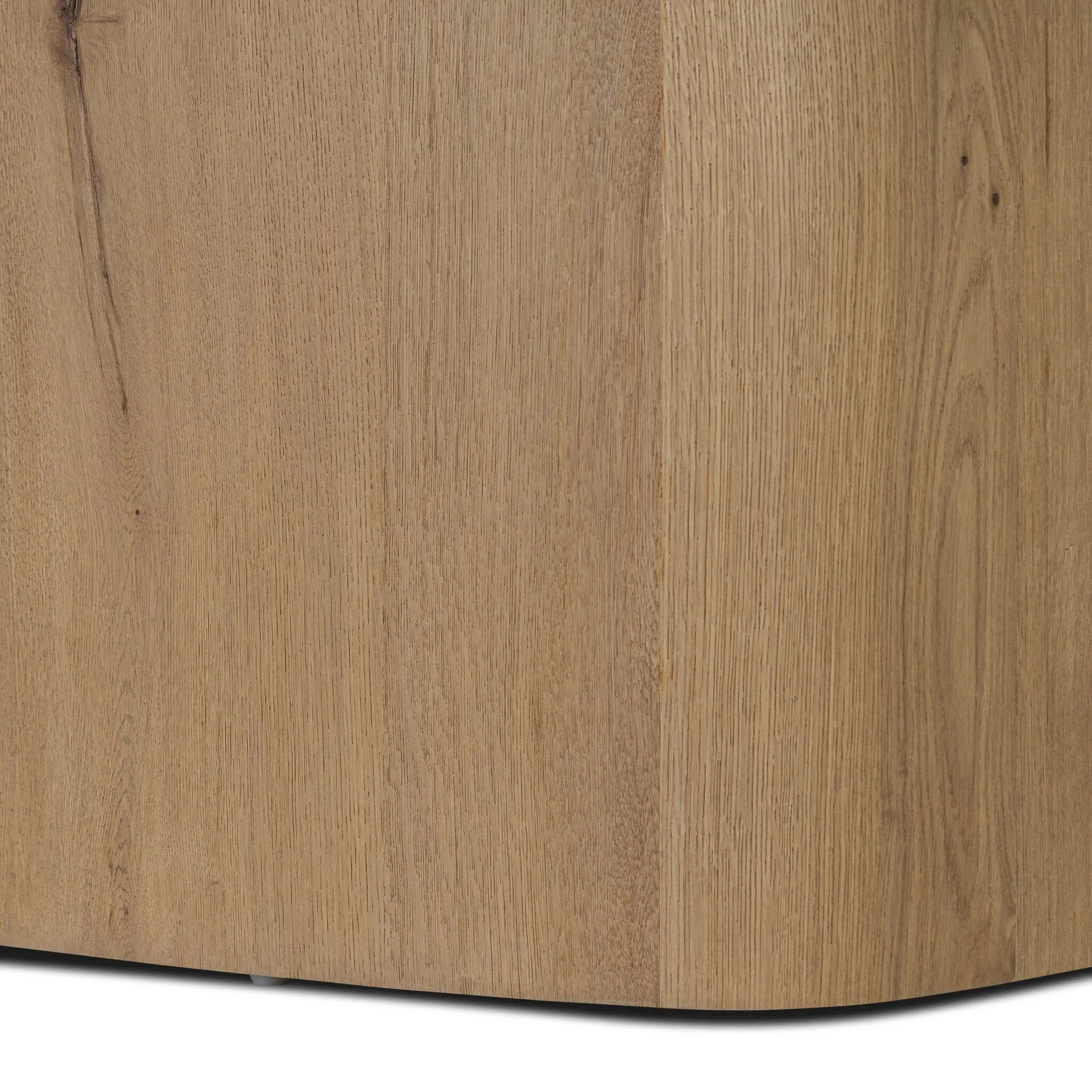 A stately dining style inspired by soft Brutalism. Crafted from aged smoked oak, a pair of matching pedestal bases features a delicate break between them, bringing a touch of lightness to such a substantial piece. A wide rectangular tabletop shapes arched sides that flow into rounded corners, finished off with bullnose edging Amethyst Home provides interior design, new home construction design consulting, vintage area rugs, and lighting in the Calabasas metro area.