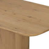A stately dining style inspired by soft Brutalism. Crafted from aged smoked oak, a pair of matching pedestal bases features a delicate break between them, bringing a touch of lightness to such a substantial piece. A wide rectangular tabletop shapes arched sides that flow into rounded corners, finished off with bullnose edging Amethyst Home provides interior design, new home construction design consulting, vintage area rugs, and lighting in the Kansas City metro area.