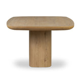 A stately dining style inspired by soft Brutalism. Crafted from aged smoked oak, a pair of matching pedestal bases features a delicate break between them, bringing a touch of lightness to such a substantial piece. A wide rectangular tabletop shapes arched sides that flow into rounded corners, finished off with bullnose edging Amethyst Home provides interior design, new home construction design consulting, vintage area rugs, and lighting in the Los Angeles metro area.