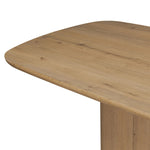 A stately dining style inspired by soft Brutalism. Crafted from aged smoked oak, a pair of matching pedestal bases features a delicate break between them, bringing a touch of lightness to such a substantial piece. A wide rectangular tabletop shapes arched sides that flow into rounded corners, finished off with bullnose edging Amethyst Home provides interior design, new home construction design consulting, vintage area rugs, and lighting in the Scottsdale metro area.