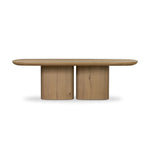 A stately dining style inspired by soft Brutalism. Crafted from aged smoked oak, a pair of matching pedestal bases features a delicate break between them, bringing a touch of lightness to such a substantial piece. A wide rectangular tabletop shapes arched sides that flow into rounded corners, finished off with bullnose edging Amethyst Home provides interior design, new home construction design consulting, vintage area rugs, and lighting in the Washington metro area.