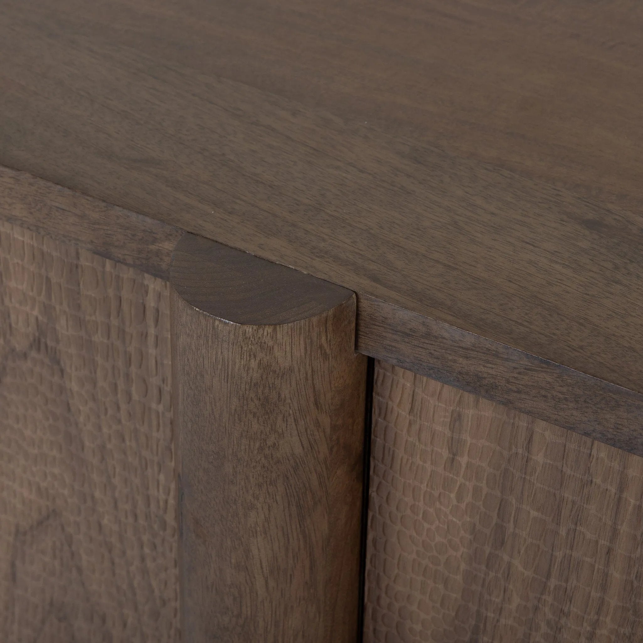 This unique, texture-driven piece offers an updated take on classic crocodile. Made from weathered solid mango, with embossed walnut door fronts. A subtly softened profile balances chunky legs, with bullnose details completing the look. Amethyst Home provides interior design, new home construction design consulting, vintage area rugs, and lighting in the Newport Beach metro area.