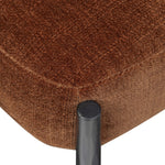 Bring a refreshed midcentury look — and pop of color — to your table. Comfortable seat and back cushions are upholstered in a velvety fabric with a soft, chenille-like feel, while slim, black-finished iron frame curves at the top to soften things up. Simple tapered legs complete the look. Amethyst Home provides interior design, new home construction design consulting, vintage area rugs, and lighting in the Dallas metro area.