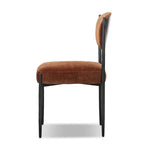 Bring a refreshed midcentury look — and pop of color — to your table. Comfortable seat and back cushions are upholstered in a velvety fabric with a soft, chenille-like feel, while slim, black-finished iron frame curves at the top to soften things up. Simple tapered legs complete the look. Amethyst Home provides interior design, new home construction design consulting, vintage area rugs, and lighting in the Tampa metro area.