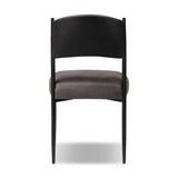 Bring a refreshed midcentury look to your table. Comfortable seat and back cushions are upholstered in a black top-grain leather, with a slim iron frame curving at the top to soften things up. Simple tapered legs complete the look.As enthusiasts of natural aesthetics at Amethyst, we love the nature inspired Bellaire Dining Chair - Palermo Black. Amethyst Home provides interior design, new home construction design consulting, vintage area rugs, and lighting in the Calabasas metro area.