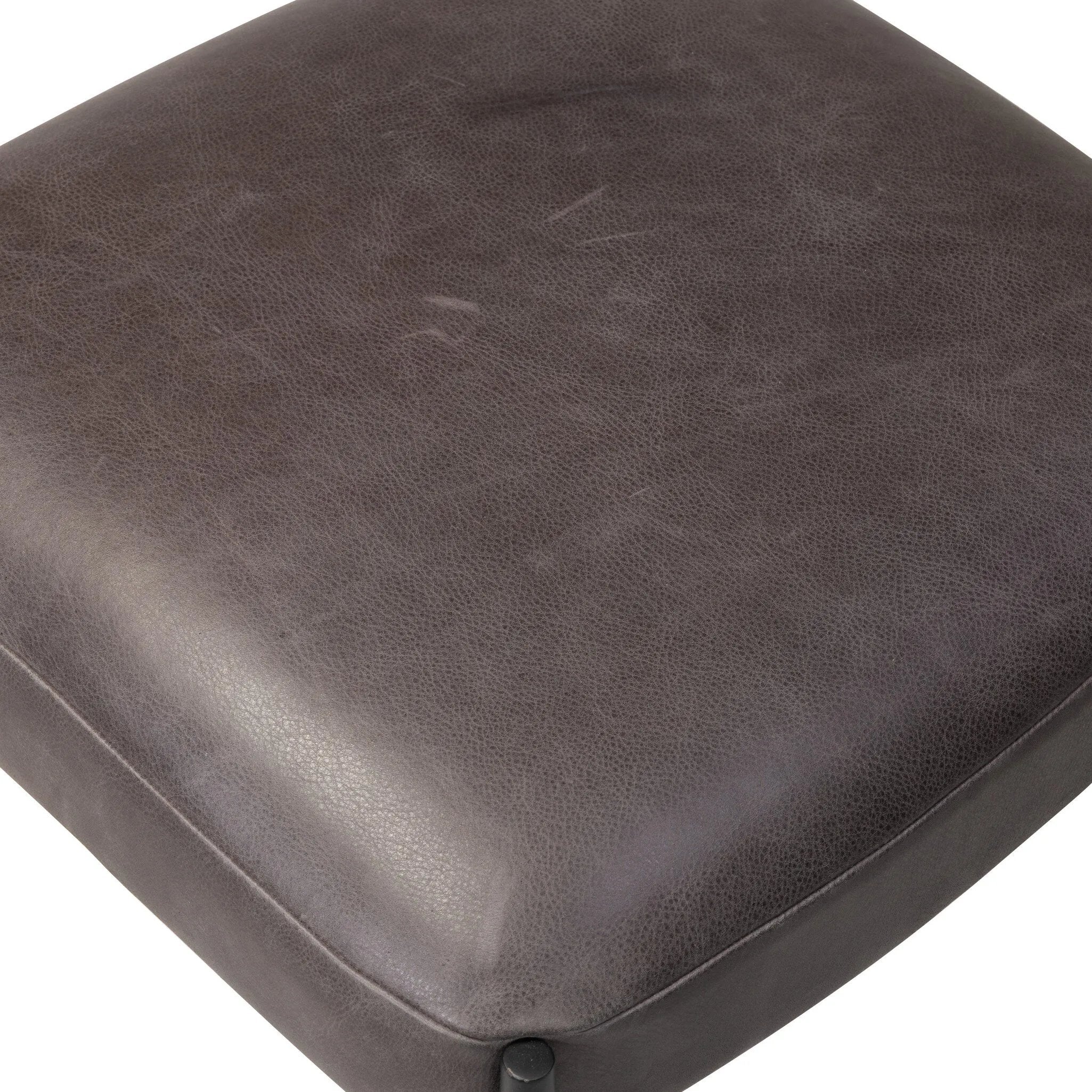 Bring a refreshed midcentury look to your table. Comfortable seat and back cushions are upholstered in a black top-grain leather, with a slim iron frame curving at the top to soften things up. Simple tapered legs complete the look.As enthusiasts of natural aesthetics at Amethyst, we love the nature inspired Bellaire Dining Chair - Palermo Black. Amethyst Home provides interior design, new home construction design consulting, vintage area rugs, and lighting in the Charlotte metro area.