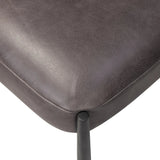 Bring a refreshed midcentury look to your table. Comfortable seat and back cushions are upholstered in a black top-grain leather, with a slim iron frame curving at the top to soften things up. Simple tapered legs complete the look.As enthusiasts of natural aesthetics at Amethyst, we love the nature inspired Bellaire Dining Chair - Palermo Black. Amethyst Home provides interior design, new home construction design consulting, vintage area rugs, and lighting in the Dallas metro area.