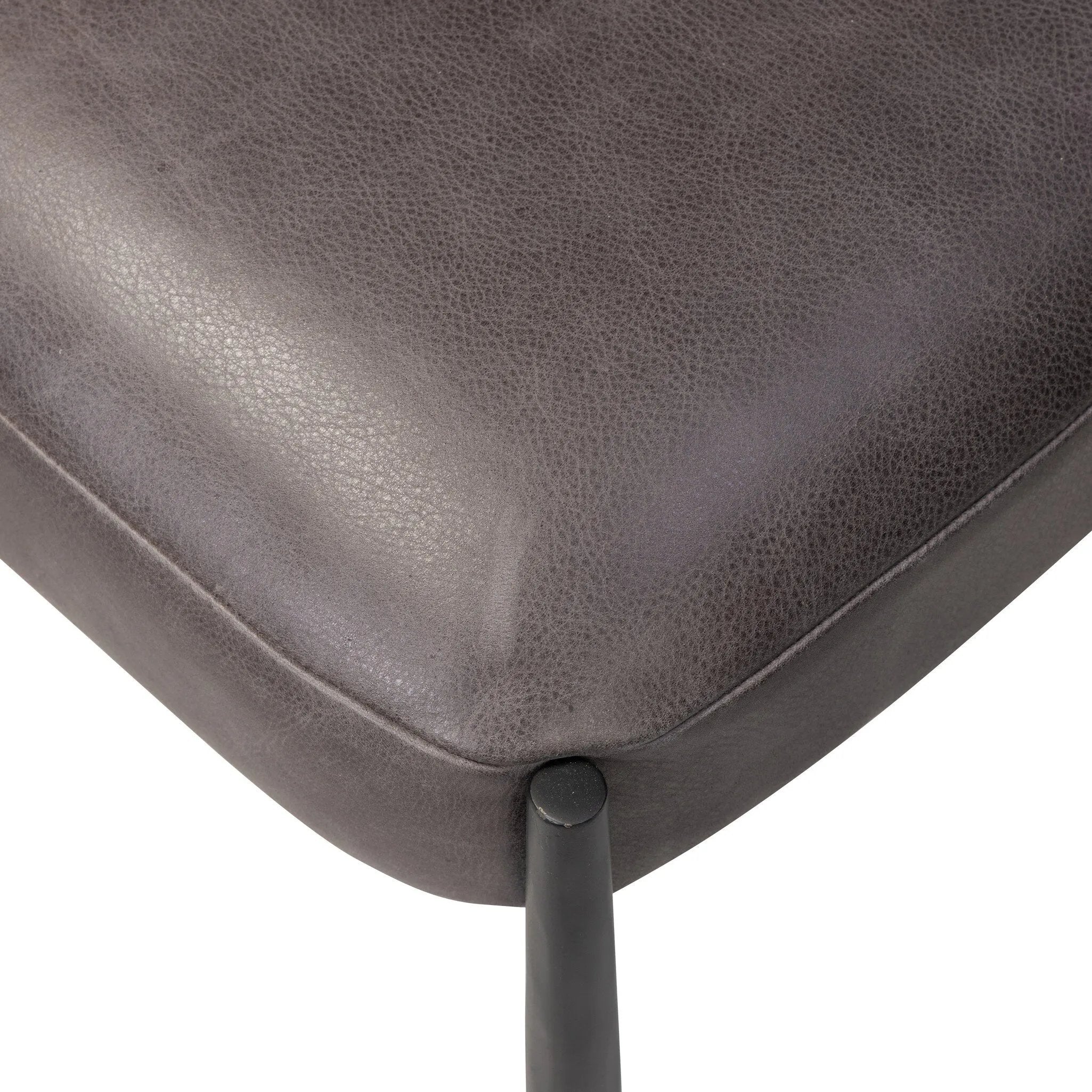 Bring a refreshed midcentury look to your table. Comfortable seat and back cushions are upholstered in a black top-grain leather, with a slim iron frame curving at the top to soften things up. Simple tapered legs complete the look.As enthusiasts of natural aesthetics at Amethyst, we love the nature inspired Bellaire Dining Chair - Palermo Black. Amethyst Home provides interior design, new home construction design consulting, vintage area rugs, and lighting in the Dallas metro area.