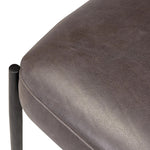 Bring a refreshed midcentury look to your table. Comfortable seat and back cushions are upholstered in a black top-grain leather, with a slim iron frame curving at the top to soften things up. Simple tapered legs complete the look.As enthusiasts of natural aesthetics at Amethyst, we love the nature inspired Bellaire Dining Chair - Palermo Black. Amethyst Home provides interior design, new home construction design consulting, vintage area rugs, and lighting in the Des Moines metro area.