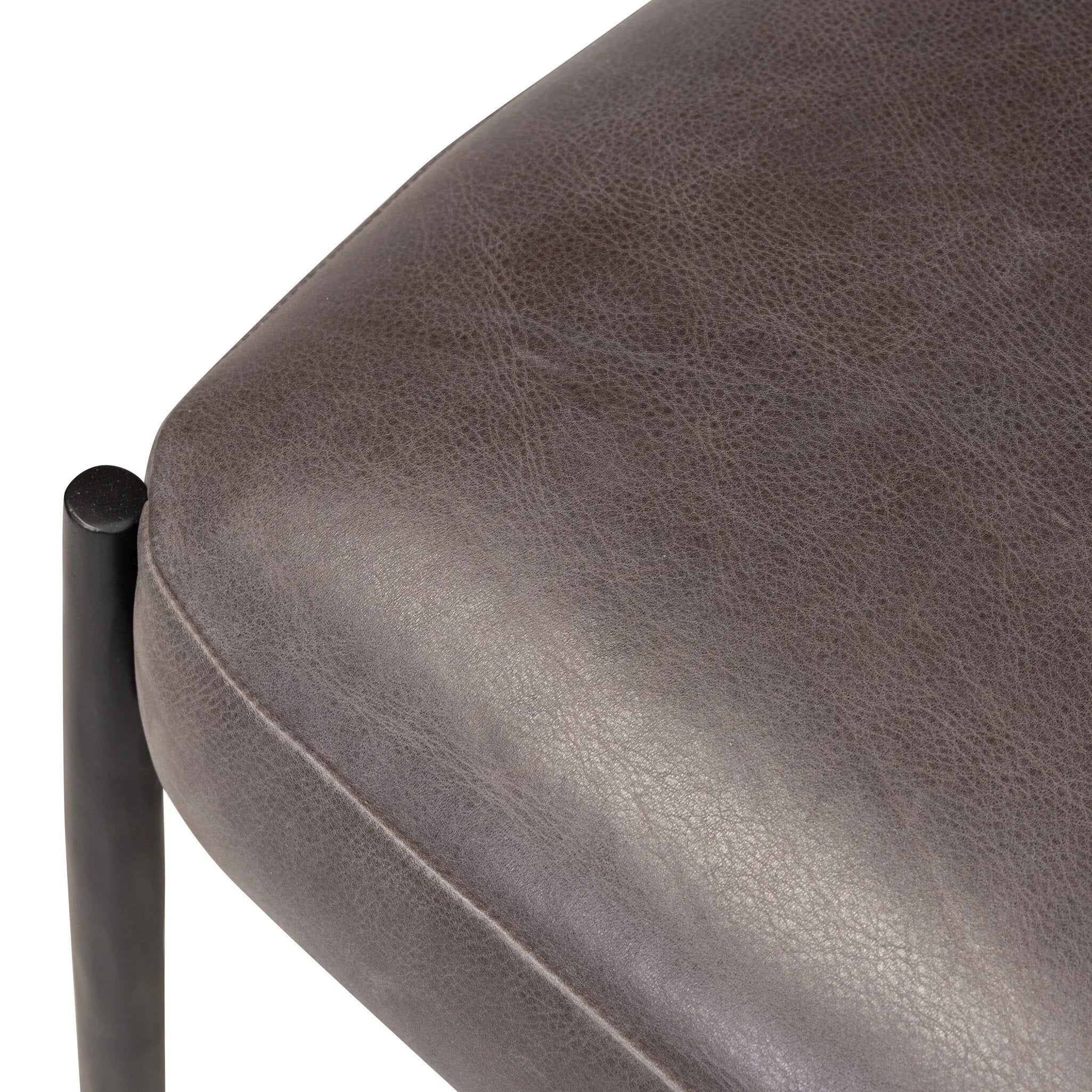 Bring a refreshed midcentury look to your table. Comfortable seat and back cushions are upholstered in a black top-grain leather, with a slim iron frame curving at the top to soften things up. Simple tapered legs complete the look.As enthusiasts of natural aesthetics at Amethyst, we love the nature inspired Bellaire Dining Chair - Palermo Black. Amethyst Home provides interior design, new home construction design consulting, vintage area rugs, and lighting in the Des Moines metro area.