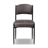 Bring a refreshed midcentury look to your table. Comfortable seat and back cushions are upholstered in a black top-grain leather, with a slim iron frame curving at the top to soften things up. Simple tapered legs complete the look.As enthusiasts of natural aesthetics at Amethyst, we love the nature inspired Bellaire Dining Chair - Palermo Black. Amethyst Home provides interior design, new home construction design consulting, vintage area rugs, and lighting in the Laguna Beach metro area.