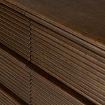 Inspired by aerodynamic-inspired Streamline Moderne style, stacked scalloped reeding wraps this spiced oak dresser with six spacious drawers. The result: a beautifully rhythmic, repeated look. With integrated hardware for a clean finish.As fans of natural materials at Amethyst, we love the nature inspired Benny 6 Drawer Dresser - Spiced Oak Veneer. Amethyst Home provides interior design, new home construction design consulting, vintage area rugs, and lighting in the San Diego metro area.