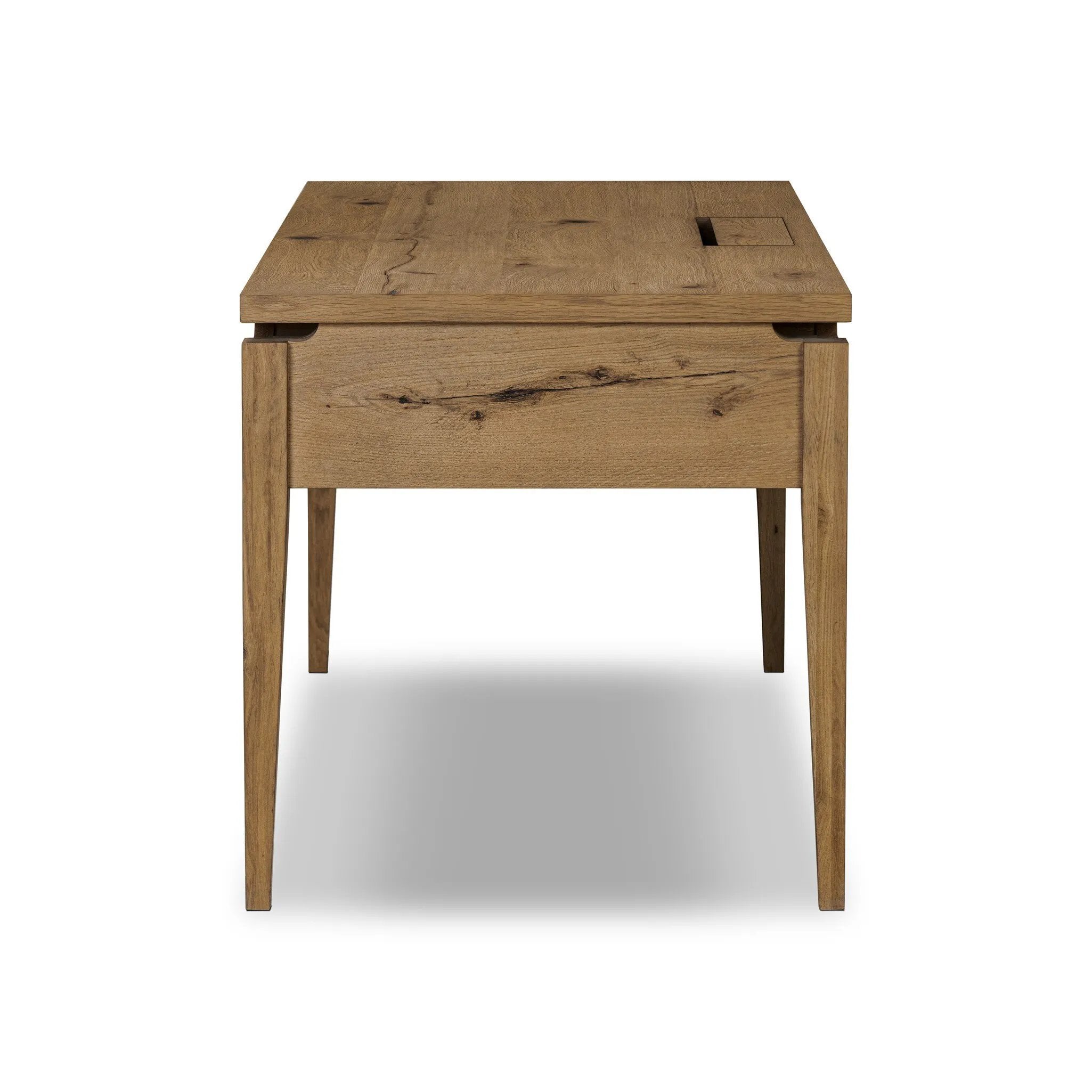 Warm up your workspace with this light-finished writing desk of rich character oak. Tapered legs and subtle corner relief details create a simplified look that complements a home office or flex space. Amethyst Home provides interior design, new home construction design consulting, vintage area rugs, and lighting in the Tampa metro area.