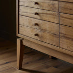 Light, natural oak reflects the New American inspiration behind this storage-driven console of warm, natural oak. Elevated on tapered legs with corner relief accents, its asymmetrical design offers storage for your media needs and more Amethyst Home provides interior design, new home construction design consulting, vintage area rugs, and lighting in the Charlotte metro area.