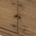 Light, natural oak reflects the New American inspiration behind this storage-driven console of warm, natural oak. Elevated on tapered legs with corner relief accents, its asymmetrical design offers storage for your media needs and more Amethyst Home provides interior design, new home construction design consulting, vintage area rugs, and lighting in the Des Moines metro area.
