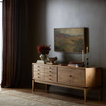 Light, natural oak reflects the New American inspiration behind this storage-driven console of warm, natural oak. Elevated on tapered legs with corner relief accents, its asymmetrical design offers storage for your media needs and more Amethyst Home provides interior design, new home construction design consulting, vintage area rugs, and lighting in the Scottsdale metro area.