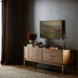 Light, natural oak reflects the New American inspiration behind this storage-driven console of warm, natural oak. Elevated on tapered legs with corner relief accents, its asymmetrical design offers storage for your media needs and more Amethyst Home provides interior design, new home construction design consulting, vintage area rugs, and lighting in the Scottsdale metro area.